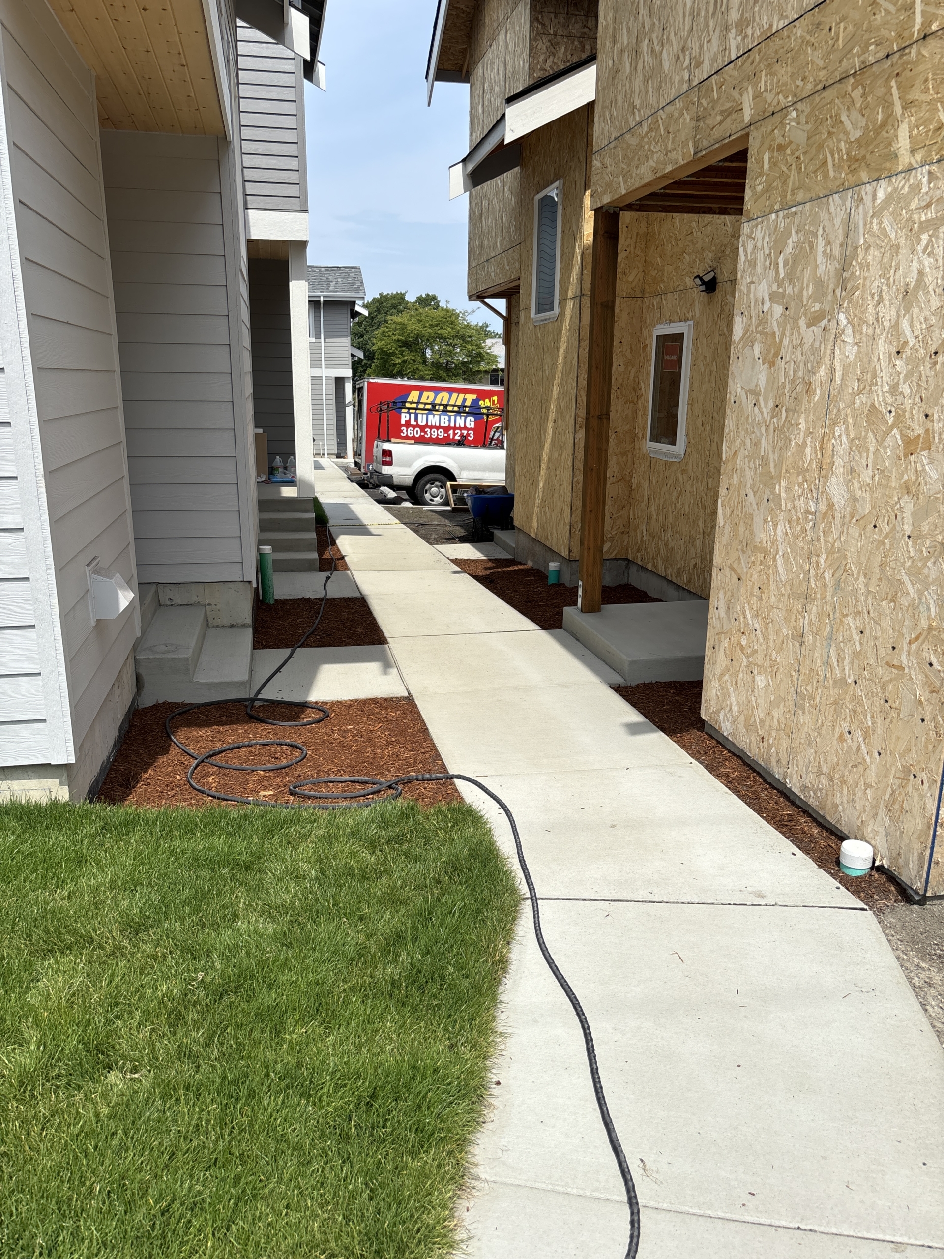 concrete path with homes on either side from Skagit Habitat for Humanity's Homebuyer Program in Anacortes, Washington.
