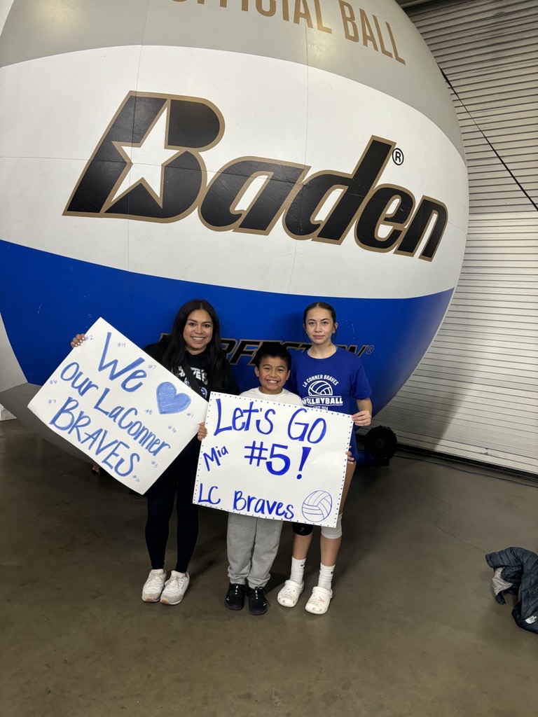 Image – 2025-03-18T074208.197 Family holding signs for a volleyball game