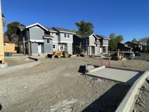 Two completed blue duplexes in Anacortes Wa for Skagit Habitat for Humanity's Homebuyer Program.
