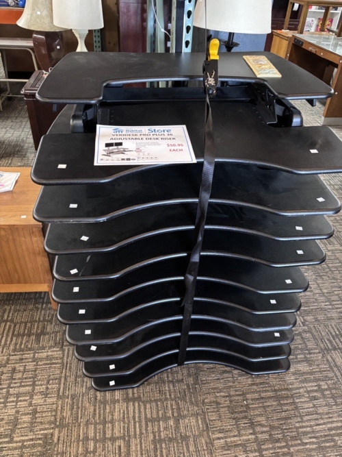 A stack of VariDesk Pro 36 desks.